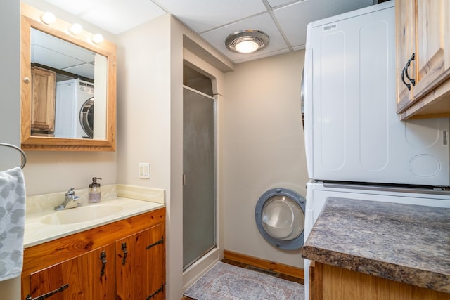 2913 125th St, Island Lake Twp, MN 56651 - full bath featuring estacked washer and dryer, a paneled ceiling, a stall shower, and vanity