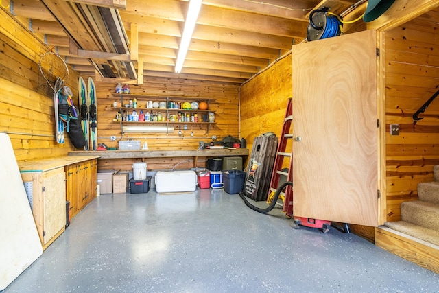 2913 125th St, Island Lake Twp, MN 56651 - garage featuring a workshop area and wooden walls