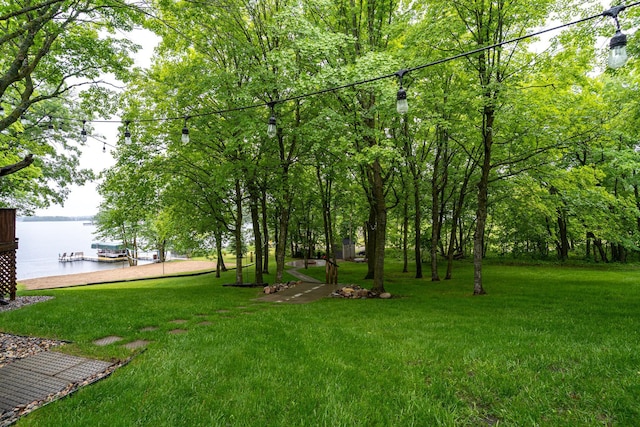 2913 125th St, Island Lake Twp, MN 56651 - view of green lawn featuring a water view and a dock