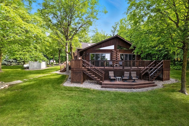 2913 125th St, Island Lake Twp, MN 56651 - rear view of house with stairs, a deck, log siding, and a yard