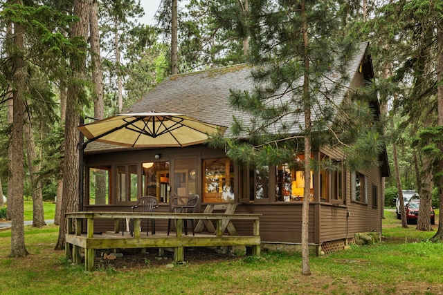 14354 Chippewa Loop, Park Rapids, MN 56470 - back of house with roof with shingles and a yard