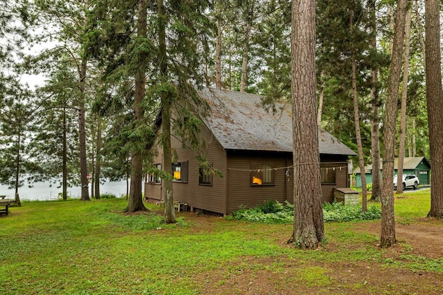 14354 Chippewa Loop, Park Rapids, MN 56470 - view of side of property with a lawn and a water view