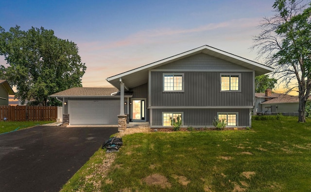 8473 Kentucky Ct N, Brooklyn Park, MN 55445 - tri-level home featuring a garage and driveway