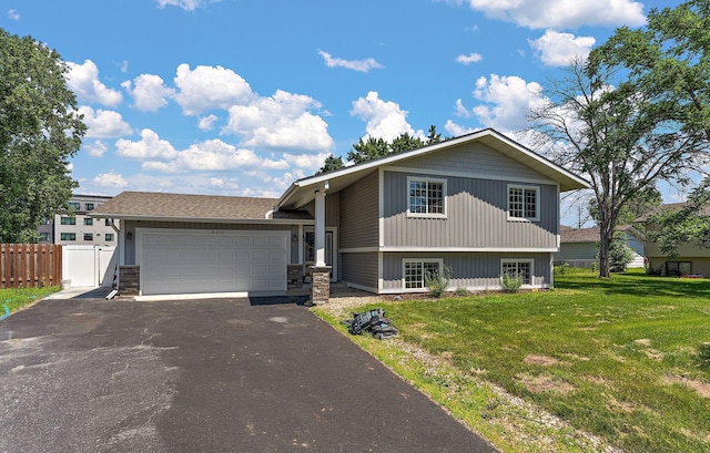 8473 Kentucky Ct N, Brooklyn Park, MN 55445 - split level home with driveway and an attached garage