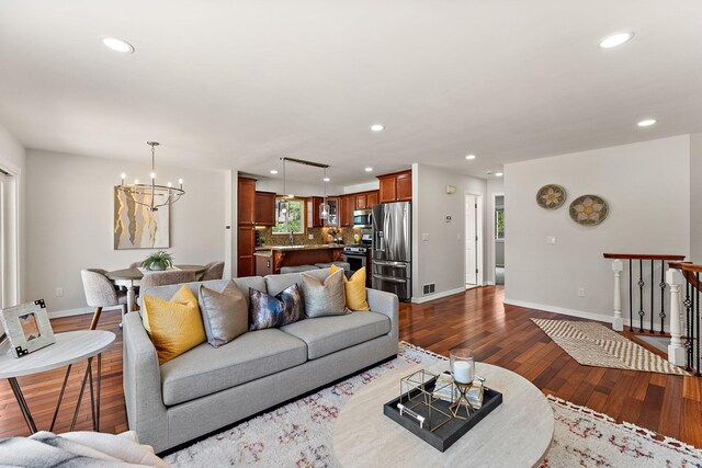 8473 Kentucky Ct N, Brooklyn Park, MN 55445 - living area with a chandelier, recessed lighting, and dark wood-style floors