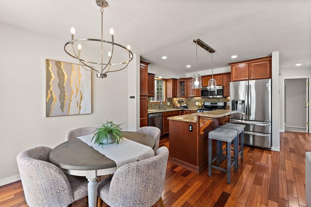 8473 Kentucky Ct N, Brooklyn Park, MN 55445 - dining room featuring a chandelier, dark wood-style floors, and recessed lighting