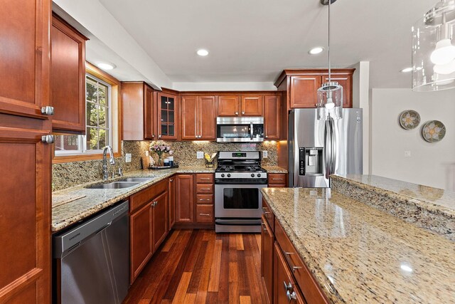 8473 Kentucky Ct N, Brooklyn Park, MN 55445 - kitchen with stainless steel appliances, dark wood finished floors, glass insert cabinets, light stone counters, and recessed lighting