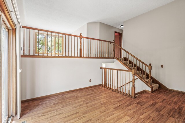 13838 Glendale Trl, Savage, MN 55378 - stairs featuring wood finished floors and baseboards