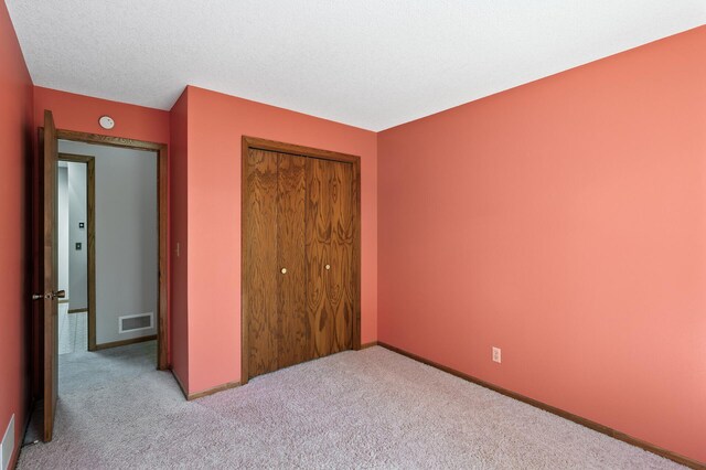 13838 Glendale Trl, Savage, MN 55378 - unfurnished bedroom featuring a closet and carpet
