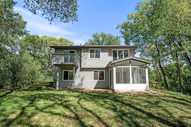 13838 Glendale Trl, Savage, MN 55378 - back of property with a sunroom and a lawn