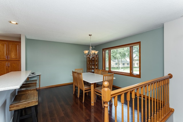3714 8th St NW, Rochester, MN 55901 - dining space with dark wood-style floors, a chandelier, recessed lighting, and a textured ceiling