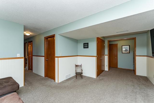 3714 8th St NW, Rochester, MN 55901 - empty room featuring carpet and a textured ceiling