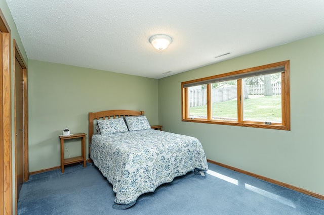 3714 8th St NW, Rochester, MN 55901 - carpeted bedroom featuring baseboards and a textured ceiling