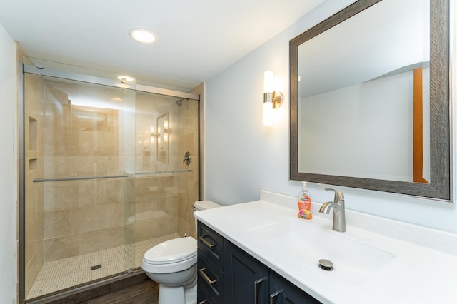 3714 8th St NW, Rochester, MN 55901 - bathroom with vanity, a shower stall, recessed lighting, and wood finished floors