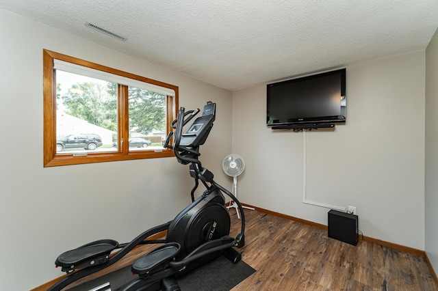 3714 8th St NW, Rochester, MN 55901 - workout area with wood finished floors and a textured ceiling