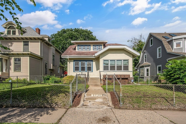 3736 Park Ave, Minneapolis, MN 55407 - view of front of home featuring stucco siding and a fenced front yard