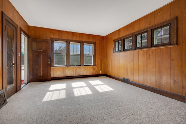 3736 Park Ave, Minneapolis, MN 55407 - carpeted spare room featuring wood walls