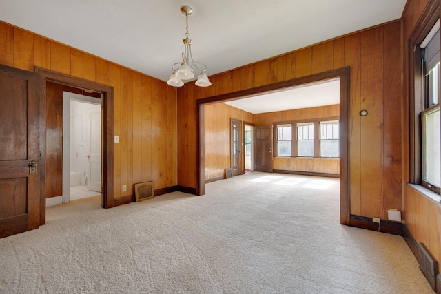 3736 Park Ave, Minneapolis, MN 55407 - carpeted empty room with wood walls