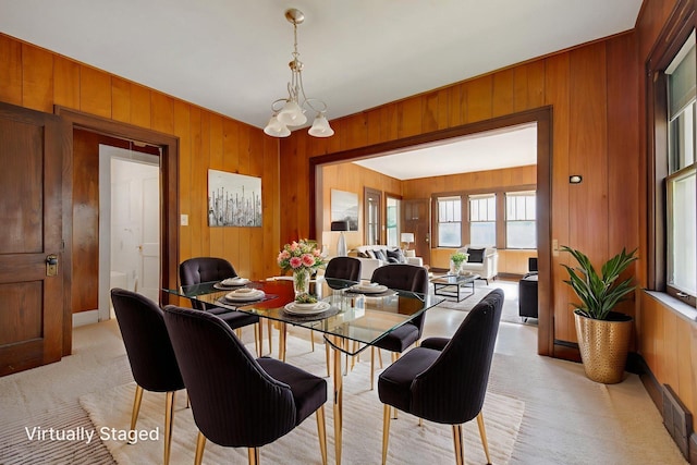 3736 Park Ave, Minneapolis, MN 55407 - dining area featuring wooden walls and light carpet