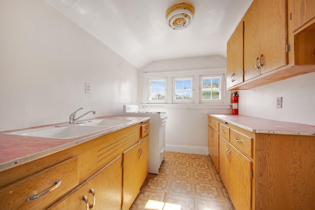 3736 Park Ave, Minneapolis, MN 55407 - kitchen with light countertops, lofted ceiling, and brown cabinets