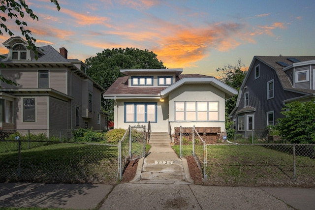 3736 Park Ave, Minneapolis, MN 55407 - view of front facade with stucco siding and a fenced front yard
