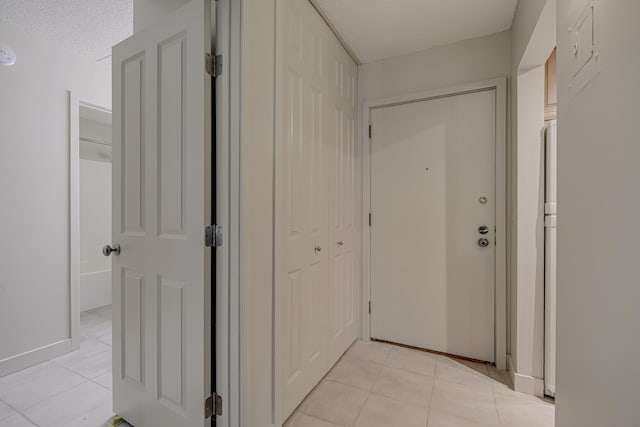 10521 Cedar Lake Rd Unit 208, Minnetonka, MN 55305 - hall featuring a textured ceiling and light tile patterned flooring