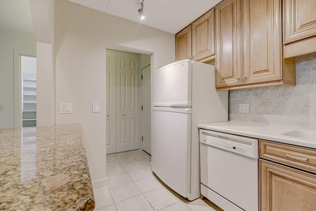 10521 Cedar Lake Rd Unit 208, Minnetonka, MN 55305 - kitchen featuring white appliances, decorative backsplash, light tile patterned flooring, rail lighting, and light stone counters