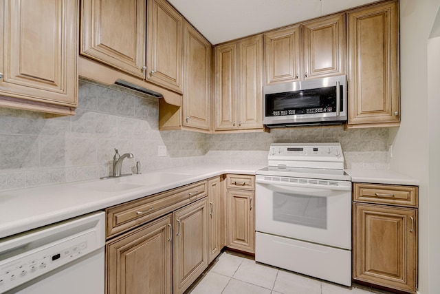 10521 Cedar Lake Rd Unit 208, Minnetonka, MN 55305 - kitchen featuring white appliances, light countertops, light tile patterned floors, and backsplash