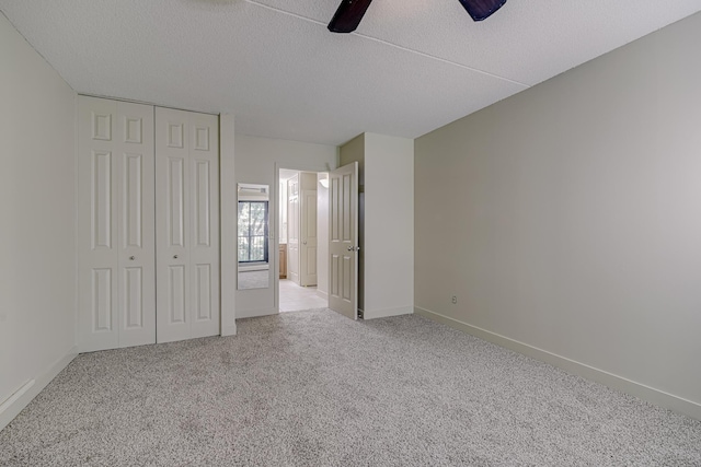 10521 Cedar Lake Rd Unit 208, Minnetonka, MN 55305 - unfurnished bedroom featuring carpet, a textured ceiling, a closet, and a ceiling fan