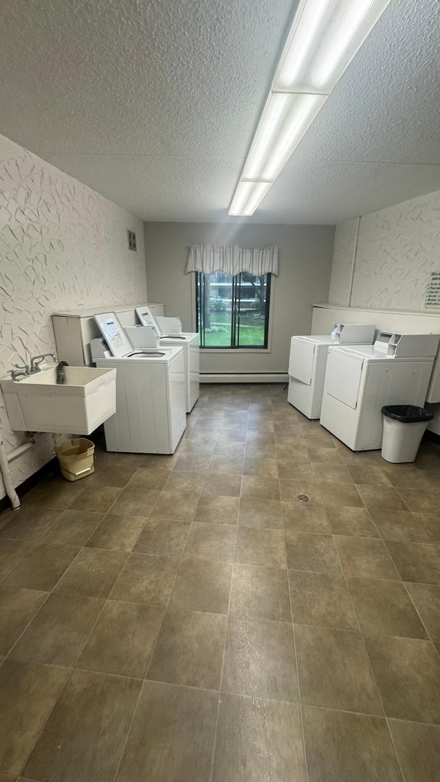 10521 Cedar Lake Rd Unit 208, Minnetonka, MN 55305 - community laundry room with independent washer and dryer and a textured ceiling