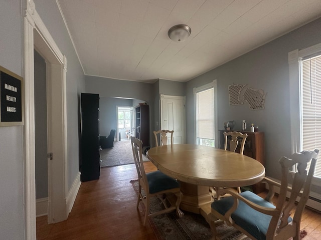 713 2nd St NE, Minneapolis, MN 55413 - dining space with wood finished floors and arched walkways