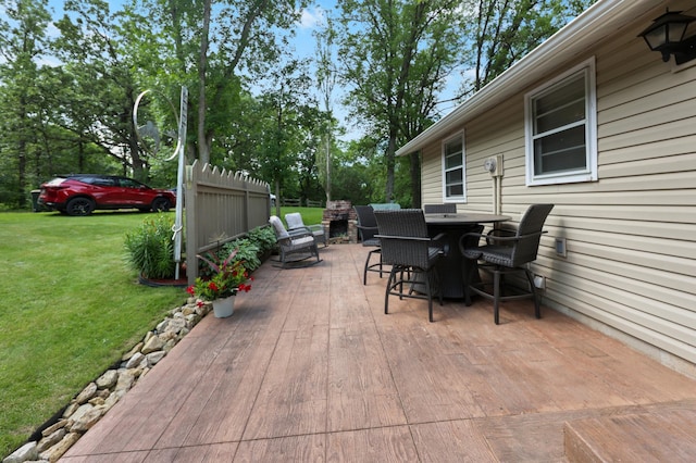 20963 Eagle Ct, Munson Twp, MN 56368 - deck featuring a yard, outdoor dining space, and a patio