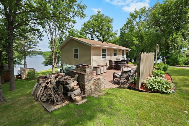 20963 Eagle Ct, Munson Twp, MN 56368 - rear view of property with a patio area, a lawn, and a water view