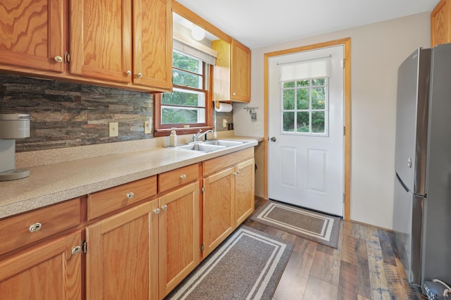 20963 Eagle Ct, Munson Twp, MN 56368 - kitchen featuring freestanding refrigerator, dark wood-type flooring, light countertops, and tasteful backsplash