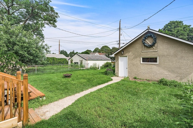 1141 Palace Ave, Saint Paul, MN 55105 - view of yard featuring an outdoor fire pit and an outdoor structure