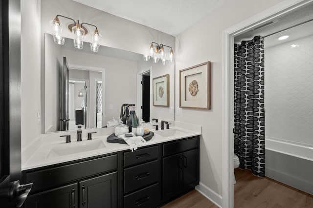 1162 Woods Creek Dr, Delano, MN 55328 - full bathroom featuring double vanity, wood finished floors, and shower / tub combo with curtain