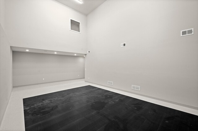 1162 Woods Creek Dr, Delano, MN 55328 - spare room featuring recessed lighting and a high ceiling