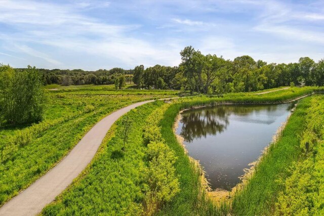 1162 Woods Creek Dr, Delano, MN 55328 - water view with a heavily wooded area