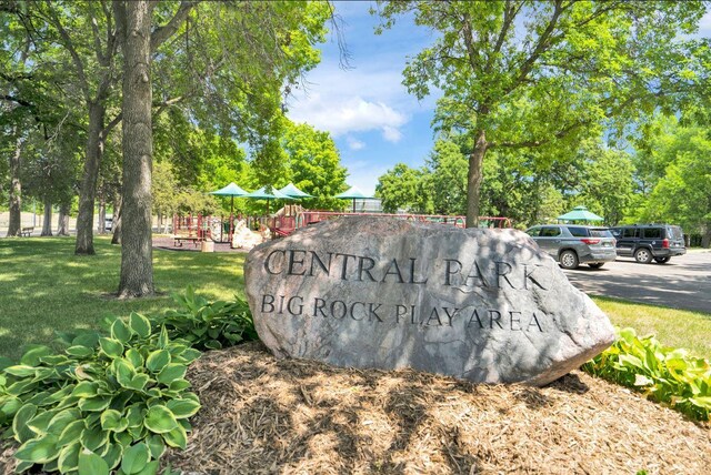 1162 Woods Creek Dr, Delano, MN 55328 - community / neighborhood sign featuring a yard