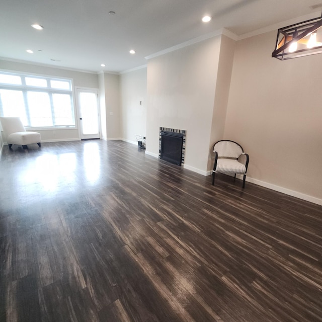 2238 Rolling Green Trl, North Mankato, MN 56003 - unfurnished living room featuring heating unit, crown molding, dark wood finished floors, a fireplace, and recessed lighting
