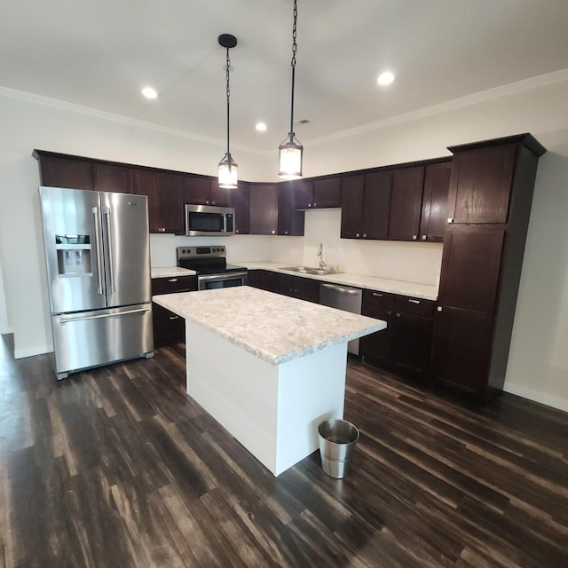2238 Rolling Green Trl, North Mankato, MN 56003 - kitchen featuring appliances with stainless steel finishes, light countertops, crown molding, dark wood finished floors, and a kitchen island
