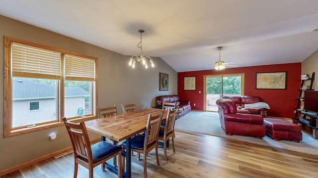 1057 John And Mary Dr SE, Chatfield, MN 55923 - dining space with light wood-type flooring, a chandelier, lofted ceiling, and a ceiling fan