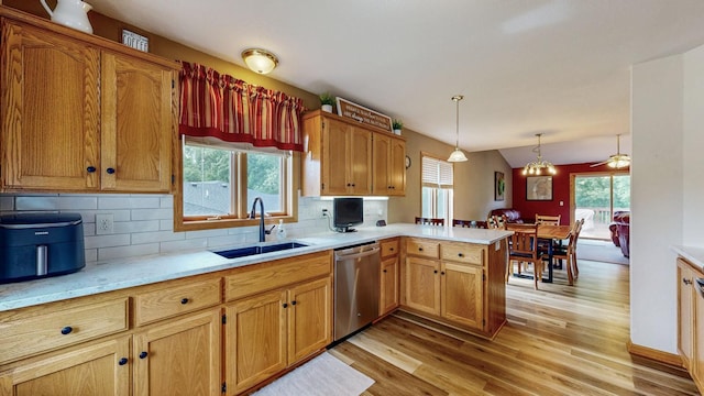 1057 John And Mary Dr SE, Chatfield, MN 55923 - kitchen featuring dishwasher, a peninsula, light wood-style floors, light countertops, and lofted ceiling