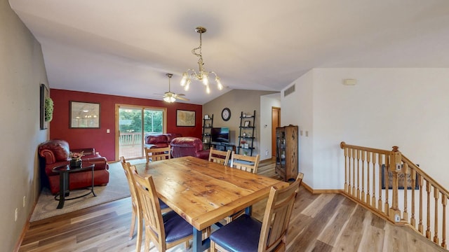 1057 John And Mary Dr SE, Chatfield, MN 55923 - dining room featuring light wood-style floors, vaulted ceiling, ceiling fan, and a chandelier