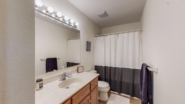 1057 John And Mary Dr SE, Chatfield, MN 55923 - full bath featuring vanity, curtained shower, and wood finished floors