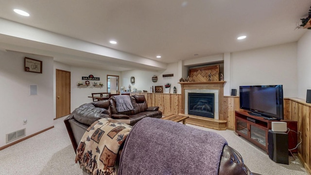 1057 John And Mary Dr SE, Chatfield, MN 55923 - living area with light carpet, recessed lighting, a tile fireplace, and wood walls
