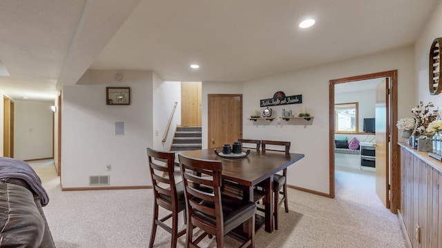 1057 John And Mary Dr SE, Chatfield, MN 55923 - dining area with light colored carpet, stairway, and recessed lighting