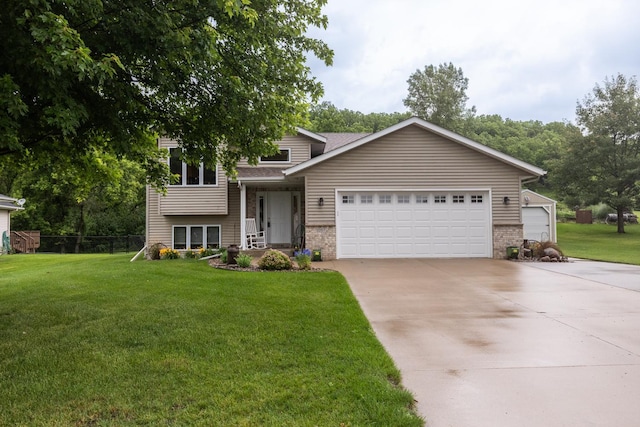 1057 John And Mary Dr SE, Chatfield, MN 55923 - split level home featuring brick siding, an attached garage, and concrete driveway