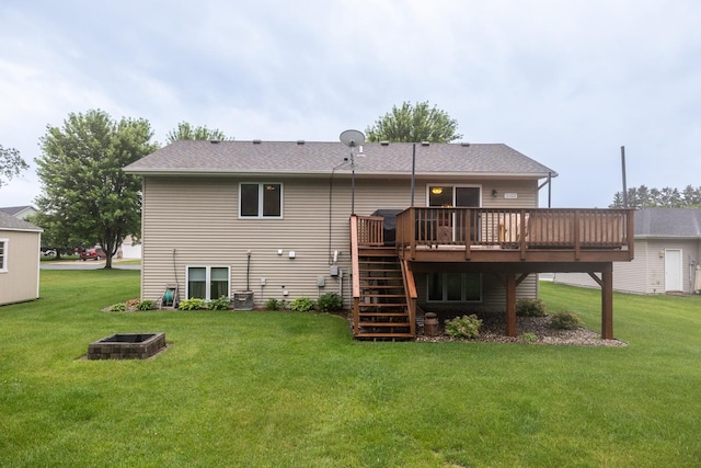 1057 John And Mary Dr SE, Chatfield, MN 55923 - rear view of house featuring a deck, stairway, a yard, and an outdoor fire pit