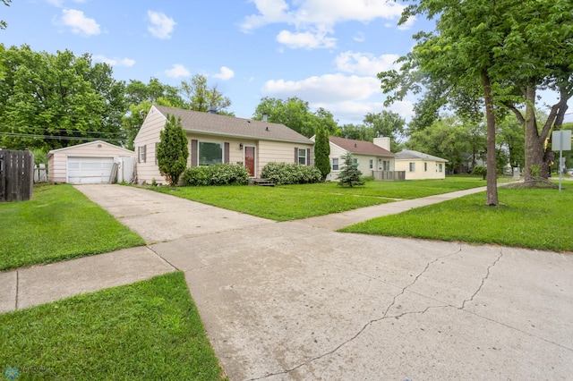 1709 13th Ave S, Fargo, ND 58103 - view of front facade featuring driveway, an outdoor structure, and a garage
